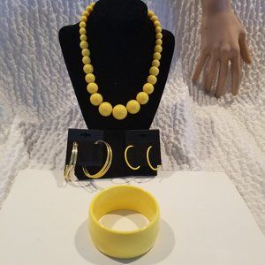 Yellow beaded necklace necklace and bracelet and 2 pair leverback earrings.